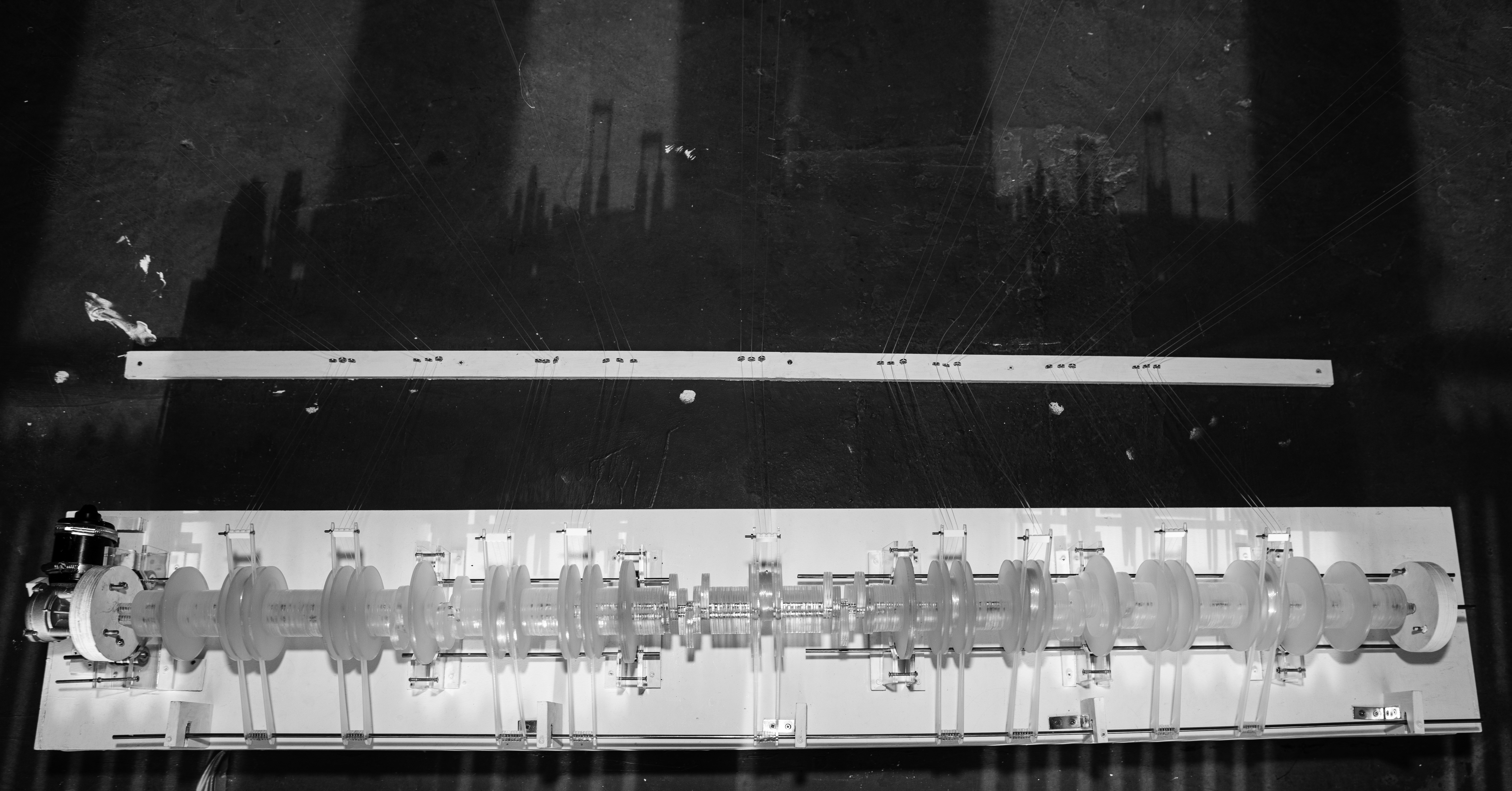 cam-shaft mechanism made with circles of acrylic with long rods attached